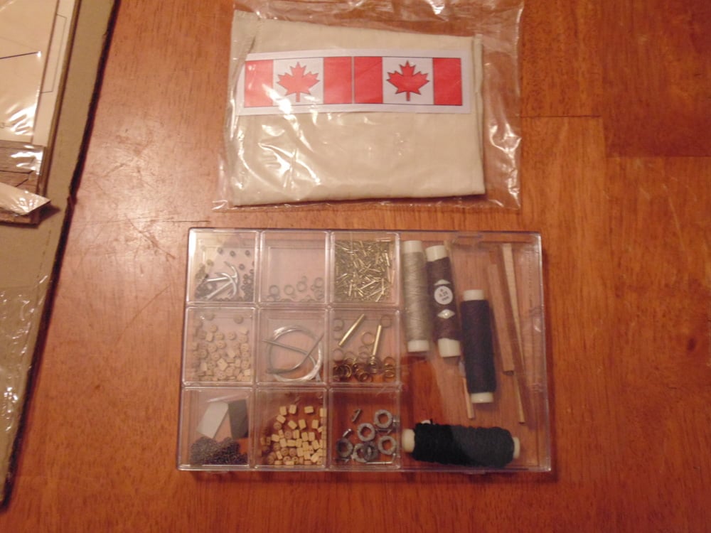 Canadian Flag with Case of Parts