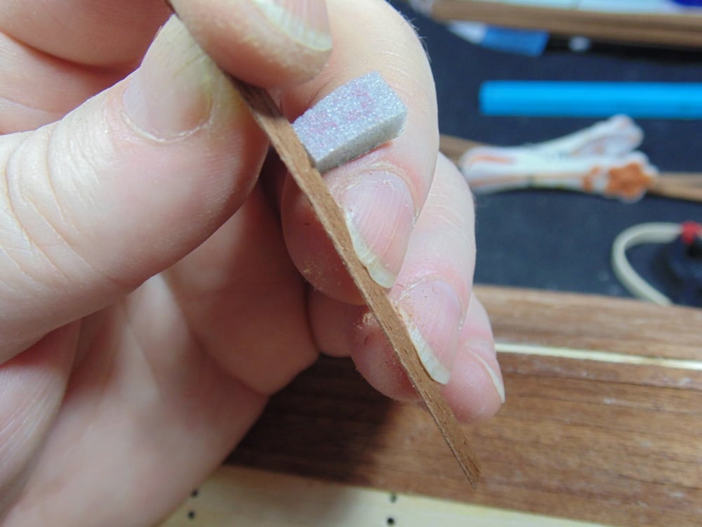 Plank in Fingernails with a Sanding Sponge