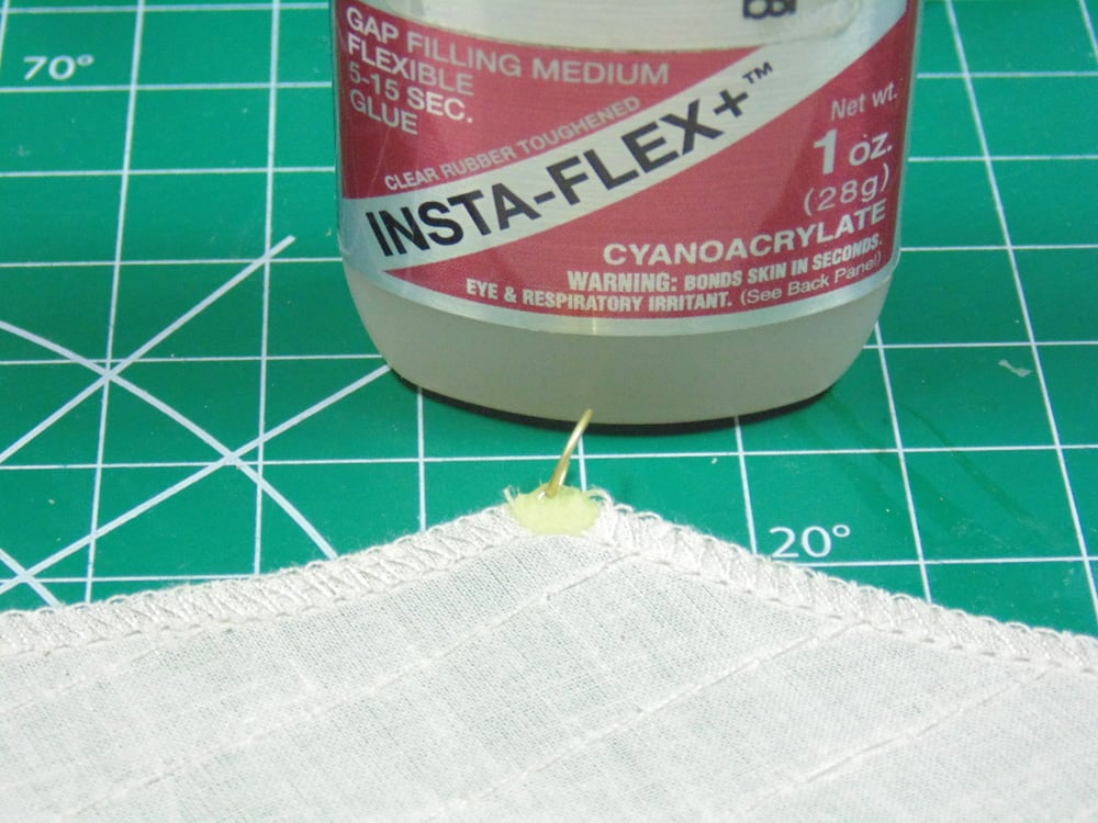 Sail tip with Cyanoacrylate CA glue bottle above