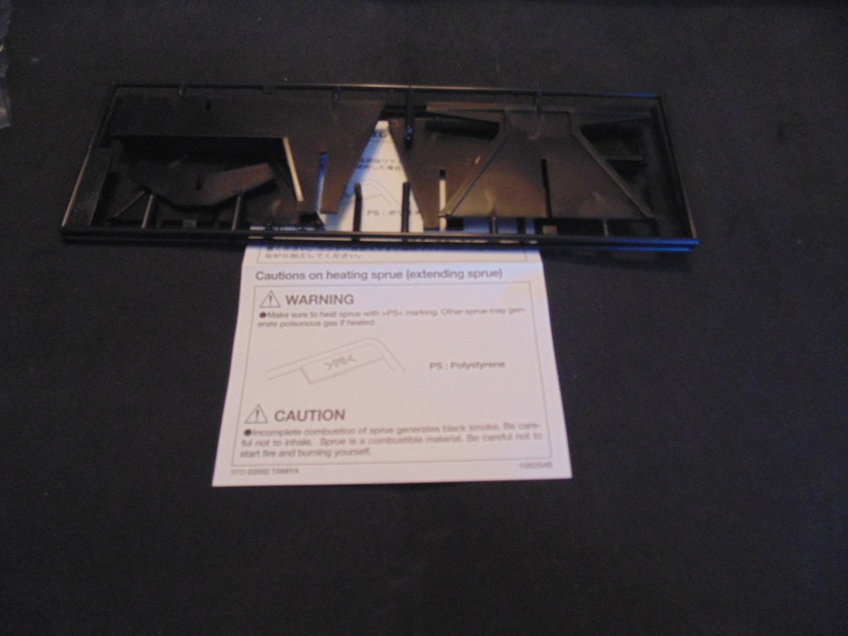Black stand sprues with caution paper slip