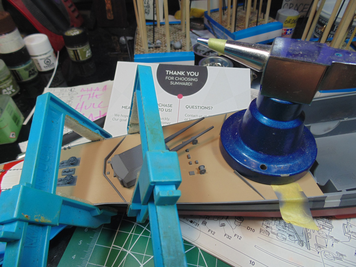 Two light blue Excel clamps on the mid bow